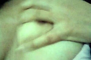 Feeling horny, I touch myself in grandma's living room with small tits exposed.