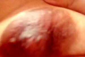 Feeling horny, I touch myself in grandma's living room with small tits exposed.