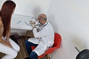 Doctor Administers Injection to Patient in Hospital Setting with Care