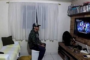 She plays Play 2 while he watches.