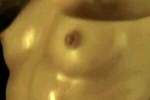 She dances gracefully, showing off her nude body.