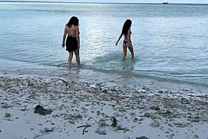 My busty stepmom and stepdaughter got soaked in golden showers on public beach