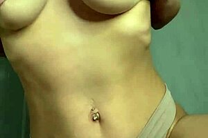 An adult film showing a hot amateur student who exposes her big natural tits