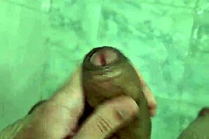 Young Brazilian gay amateur cums in the shower solo.