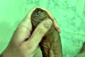 Young Brazilian gay amateur cums in the shower solo.