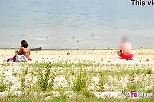 Ebony babe rides guy bent over next to the lake