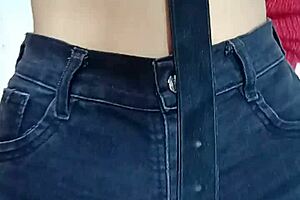 i'm playin with a belt spankin her pussy hard.