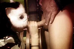 A guy spots a naughty brunette in a kitty mask, eager for a facial.