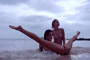 Four beautiful girls enjoy nude beach day