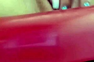 She squirts while masturbating her wet pussy on webcam.