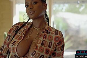 Huge natural tits on ebony Playboy model Nyla showing every curve.