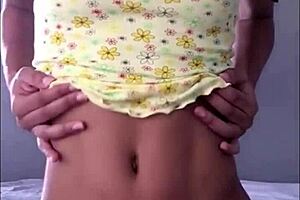 Petite teen shows off her puffy pink pussy