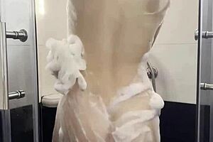 Beautiful student fiercely masturbates with vibrator in steamy shower scene