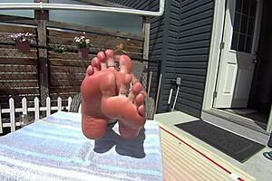 Blonde girlfriend in bikini shows off toes and feet as barefoot housewife babe