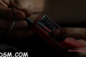 Brunette slave rides huge fake penis in BDSM