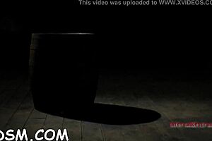 Brunette slave rides huge fake penis in BDSM