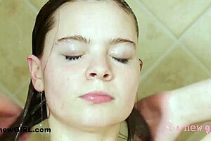 young brunette enjoys a relaxing shower in the bathroom