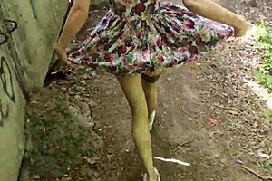 Beautiful woman gives a public blowjob in a dress