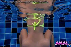 Skinny Thai girl swims in bikini with big butt plug in ass