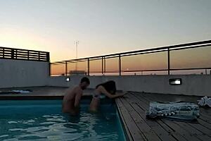 Beautiful big tits and big black cock in hot anal scene at sunset next to the pool
