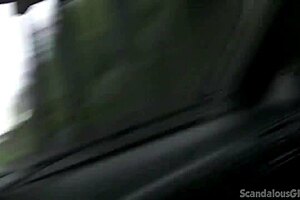 Brunette babe handjobs cock while driving caught on tape