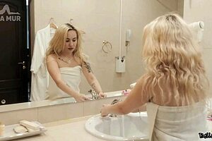 Curvy blonde gets wet and wild in the shower
