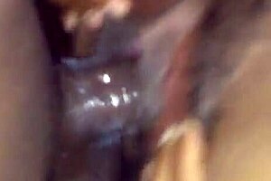 Black beauty gets a lot of cum on her face