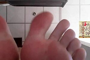 Close-up footage of pussy lips and tight toes being licked
