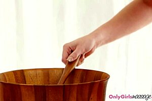 Beautiful woman with shaved genitals on top during sensual massage