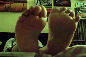 Mature wife enjoys her sexy feet being licked in intense feet fetish play.