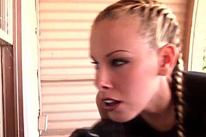 Two lesbian friends lick big tits and asses with strap on in warehouse