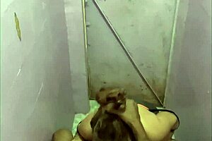 Detailed view of cheating wife giving blowjob in bathroom at work