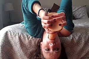 A petite girl gets a deepthroat dildo gag in this homemade porn video