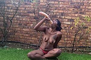 Indian amateur deepthroats dildo in garden, gagging and vomiting