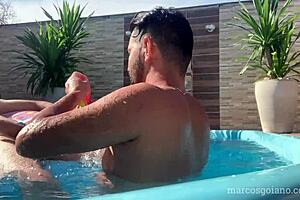 Marcos goiano bends over for joseph dotado's bareback creampie in the pool.
