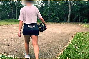 braless milf flashes in short skirt playing basketball outdoors—no panties!