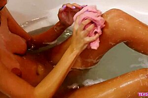 Steamy bath scene with a college student showing off her slim body