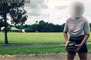 braless milf flashes in short skirt playing basketball outdoors—no panties!