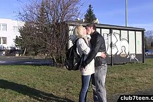 A blonde teenager gets tempted by a man in a park