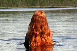 Naked redhead TEEN plays with a WATER LILY