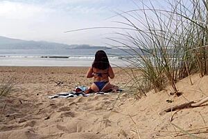 hey, ever seen a curvy milf change and workout on the beach?