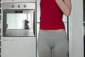 Petite brunette performs short gym routine in leggings showing small tits and narrow ass