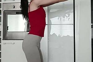Petite brunette performs short gym routine in leggings showing small tits and narrow ass