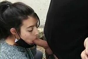 hot babe gives blowjob in the street, risking getting caught flashing tits outdoors