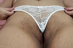 Beautiful young woman in lingerie teases sensually