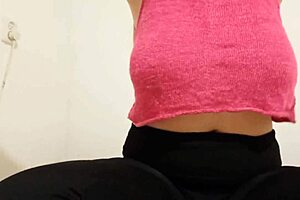 cowgirl in pink top plays with big boobs and squirts during solo orgasm