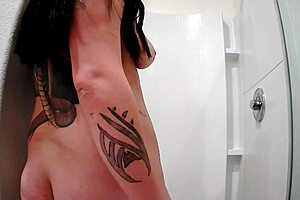 Raven Grey showers with shaved pussy on display