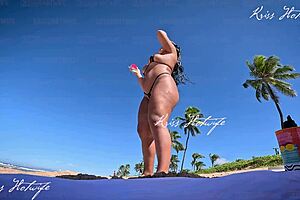 Tanned beauty flaunts big tits and ass outdoors publicly