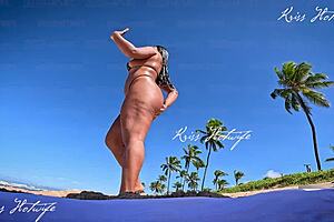 Tanned beauty flaunts big tits and ass outdoors publicly