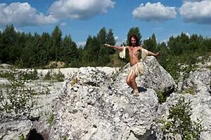 Mature topless dance in stone quarry
